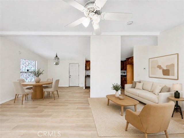 virtually staged living room illustrating a possible furniture layout