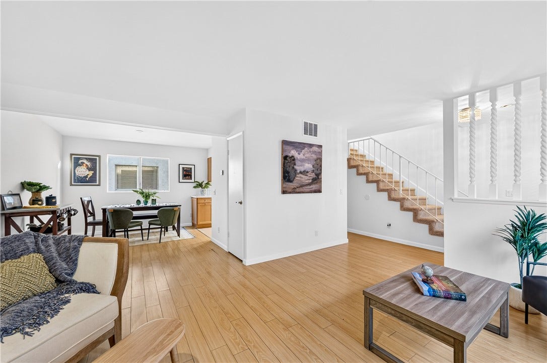 Open-concept main level seamlessly connects the living and dining areas for versatile everyday living.