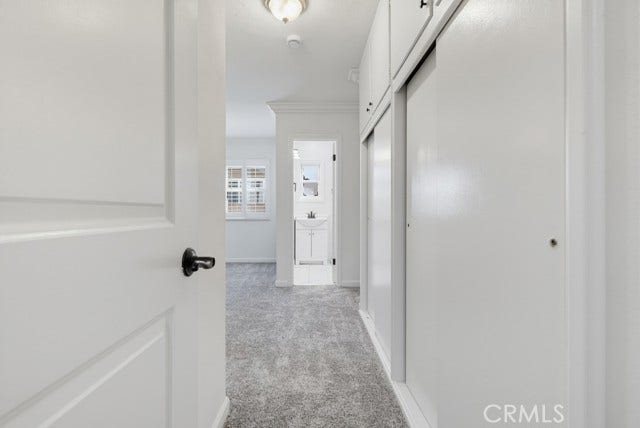 1901 E 63rd, Long Beach, CA 90805 View of primary bedroom & bathroom from hallway.