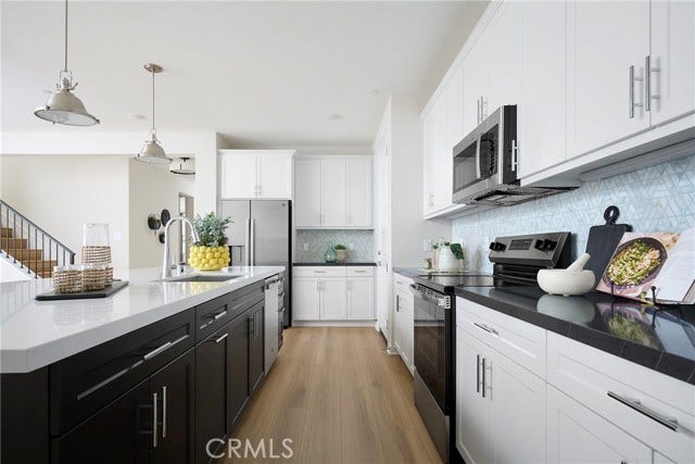 26159 Pepper Tree Ridge RD, Corona, CA 92883 Model Photos: Photos shown are of the model home for this floor plan. Actual finishes, features, and landscaping may vary.