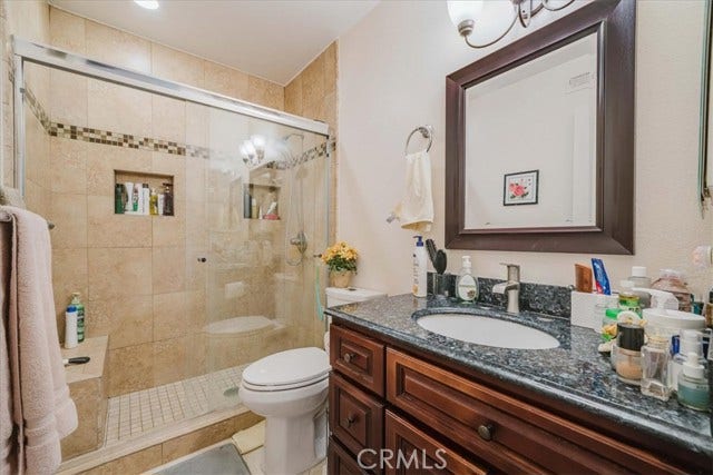 Remodeled primary bathroom with walk-in shower