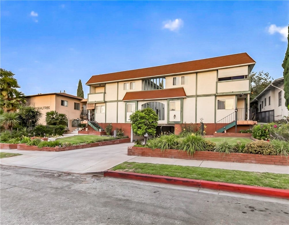 Distinctive architectural details and thoughtfully landscaped frontage create impressive curb appeal.