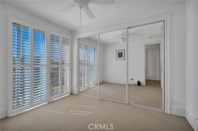 Large 3rd bedroom with mirrored wardrobes.