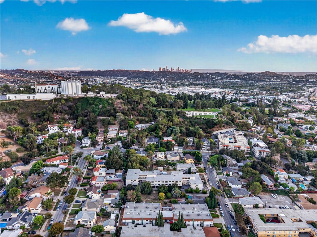 Expansive aerial perspective showcases the surrounding Glendale landscape and Verdugo Mountain backdrop.