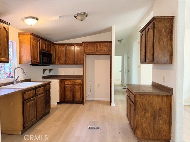 spacious kitchen with generous cabinetry and ample counter space.