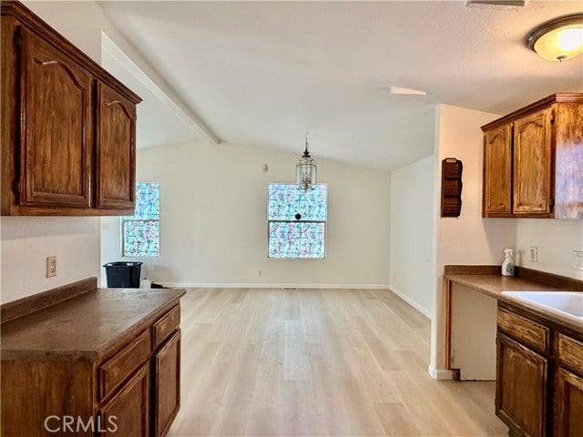 kitchen opens to the adjoining dining area