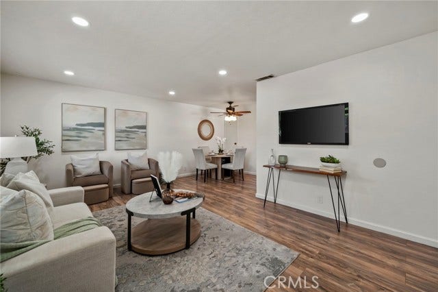 3125 N White AVE, #4, La Verne, CA 91750 Spacious living area with recessed lighting and adjoining dining space perfect for relaxing at home or entertaining.