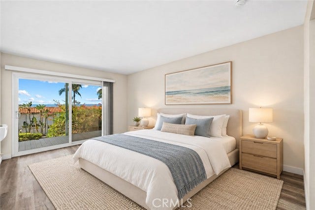 Primary suite with deck access - ocean view (virtual stage)