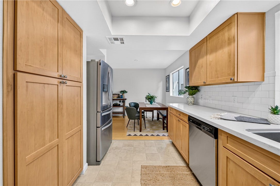 Thoughtfully designed kitchen combines abundant cabinetry, contemporary finishes, and practical workspace.