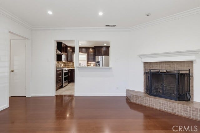 1901 E 63rd, Long Beach, CA 90805 Formal living room with view of fireplace and bar into kitchen.