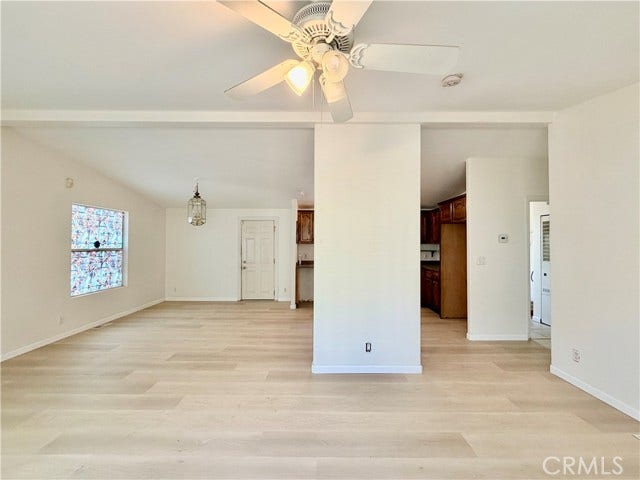 connected living and dining spaces offer a flexible furniture layout.