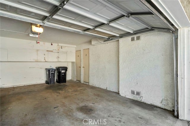 3125 N White AVE, #4, La Verne, CA 91750 Shared two-car garage with one designated parking space for the residence, providing convenient covered parking.
