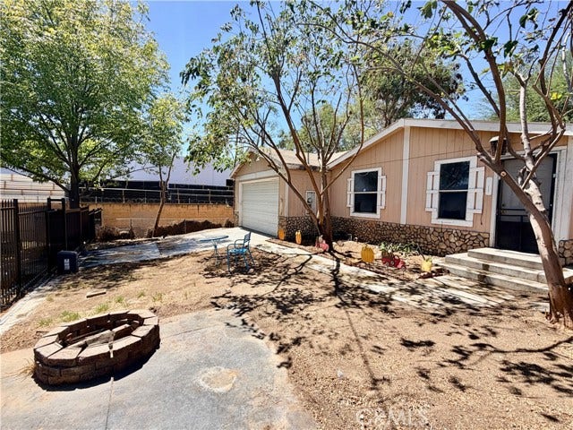 front yard with mature trees and space to enjoy the outdoors.