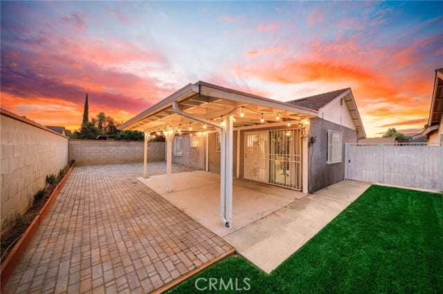Private rear yard with cover