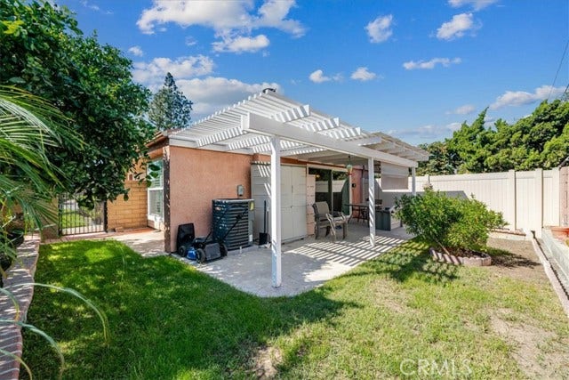 Spacious backyard with a covered patio