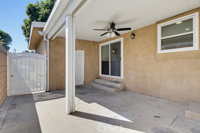 1901 E 63rd, Long Beach, CA 90805 Side patio with side gate to front yard, man door to garage and slide glass door to kitchen.