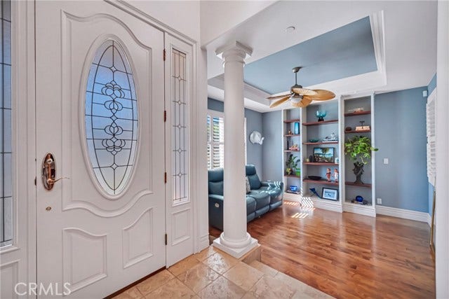 Tiled entry opens to intimate living room.