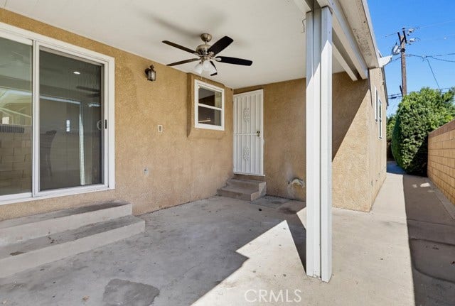 1901 E 63rd, Long Beach, CA 90805 Another view of the side patio with separate entrances to primary bedroom and slide glass door to kitchen.