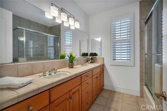 Upstairs bath with double sinks.