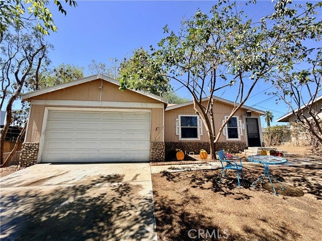 attached two car garage with additional driveway parking.