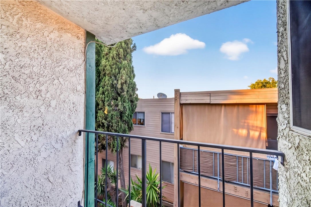 Private balcony provides an inviting outdoor extension with open-sky views and natural light.