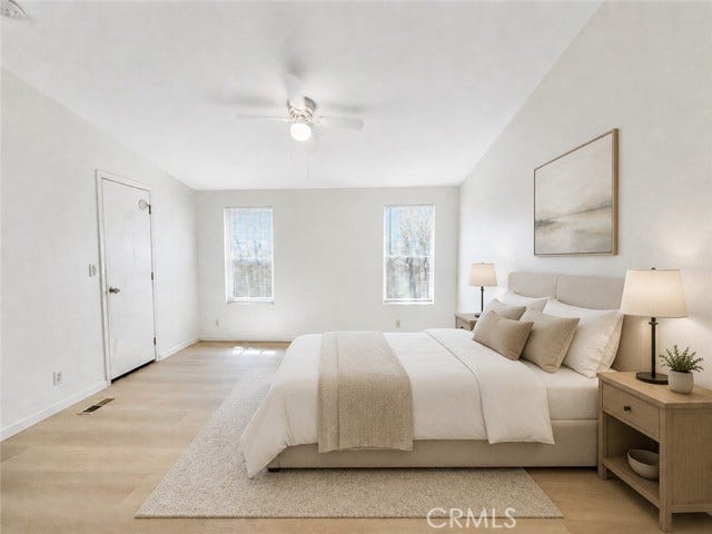 virtually staged living room illustrating a possible furniture layout