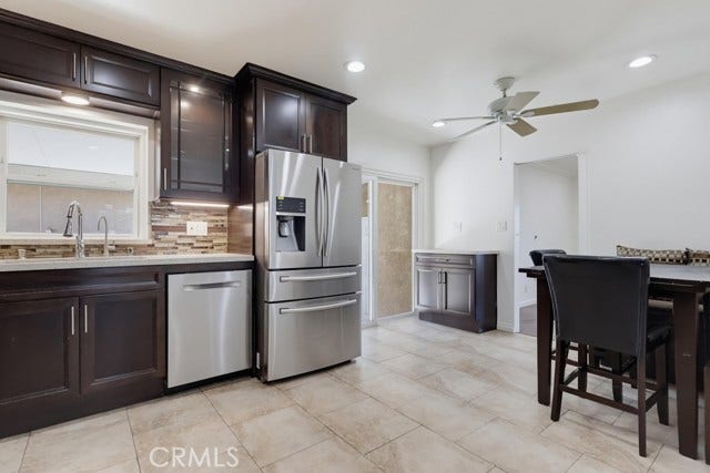 1901 E 63rd, Long Beach, CA 90805 Different view of kitchen.... with sliding glass door to side patio.