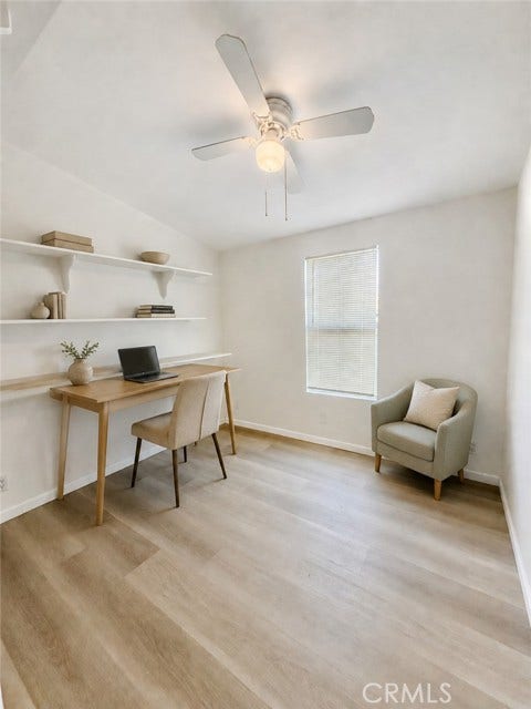 virtually staged living room illustrating a possible furniture layout