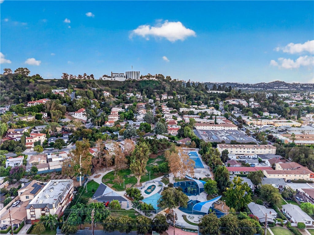 Panoramic perspective highlights the area s blend of residential neighborhoods, open spaces, and surrounding hills.