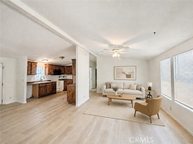 virtually staged living room illustrating a possible furniture layout
