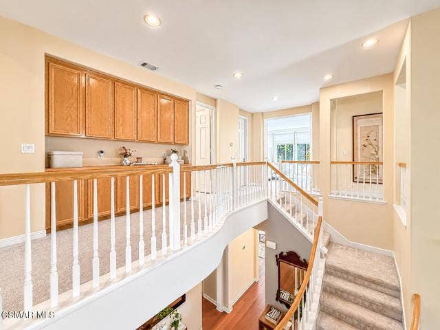 Bright Oak-Toned Upstairs Hallway Landin