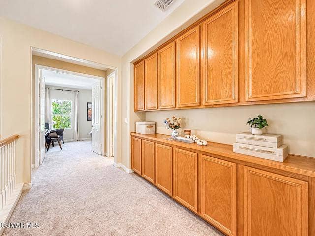 Warm Oak Cabinetry Hallway Landing