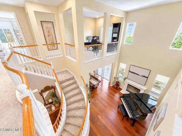 Sunlit Curved Staircase Foyer