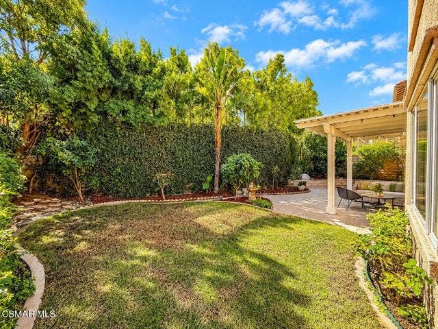 Sunny Backyard Patio and Lush Garden