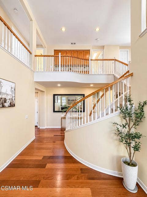 Elegant Curved Staircase Foyer (1)