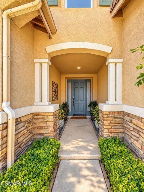 Symmetrical Suburban Entryway with Lush